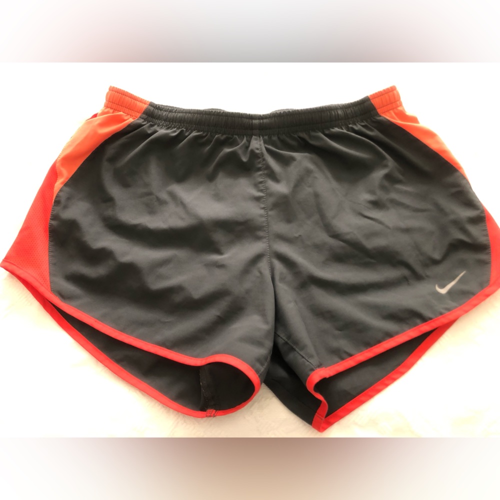 Black and orange Nike dry fit women’s running shorts